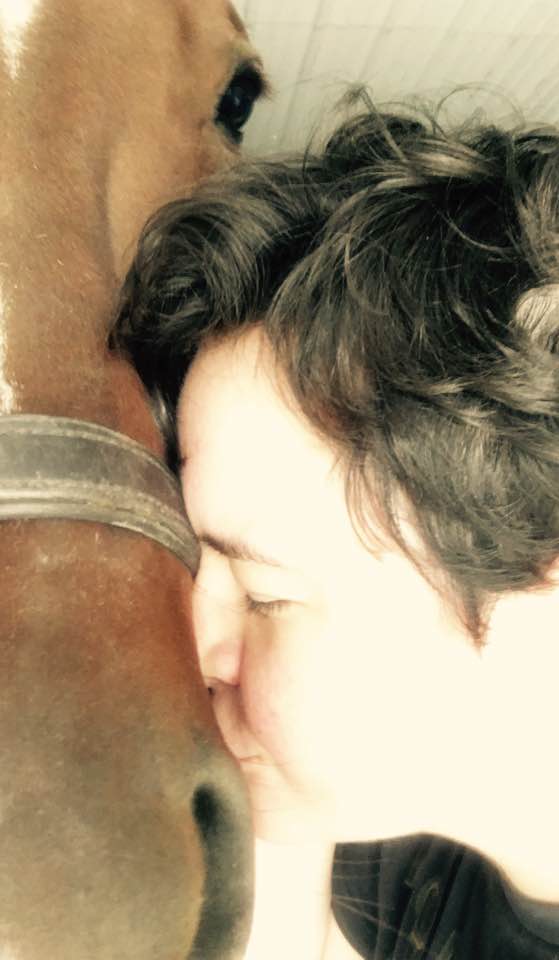 My daughter cuddling and kissing a horse last week. 